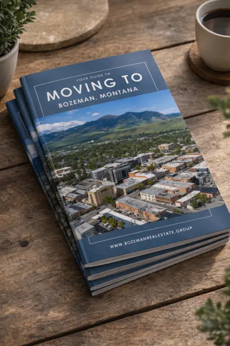 Moving to Bozeman guides on wooden table