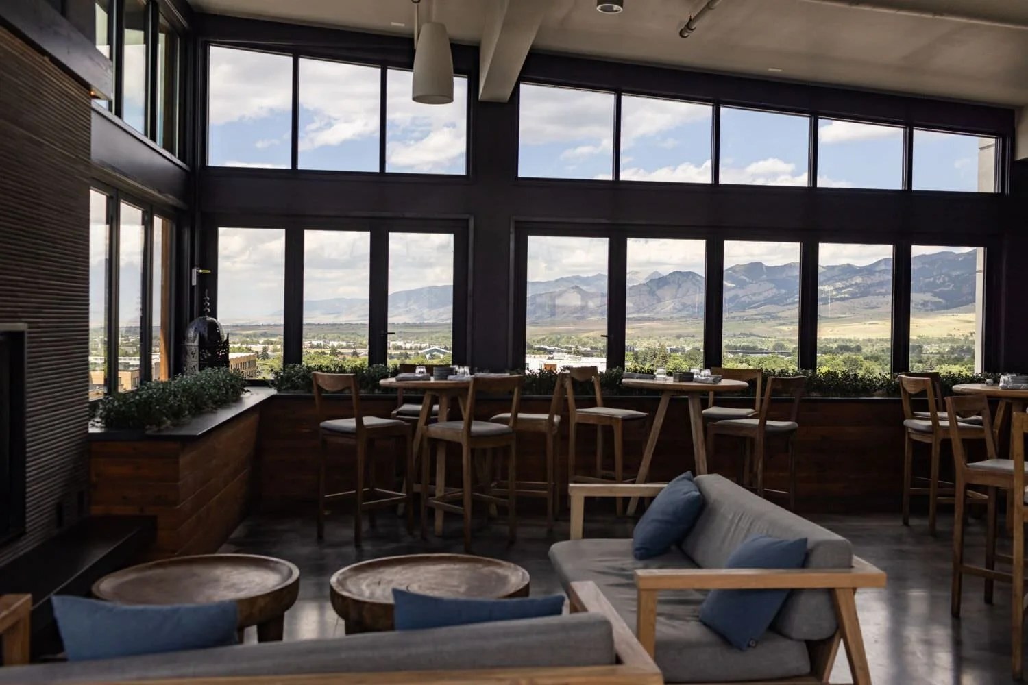 Sky Shed rooftop bar in Bozeman with floor-to-ceiling windows and mountain views